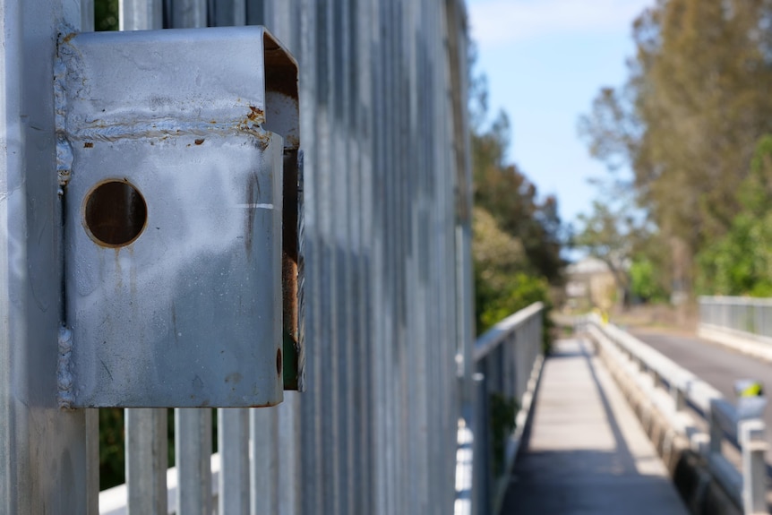 Close up of cut gate lock.