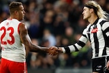 Lance Franklin shakes Darcy Moore's hand after a game