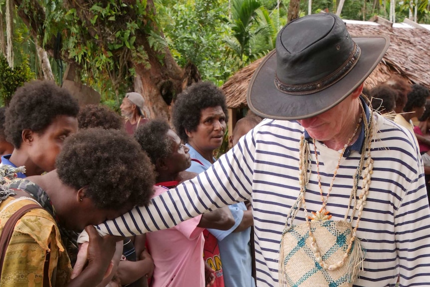 An emotional farewell ... Sean Dorney says goodbye before boarding a boat to leave Tulu, possibly for the last time.