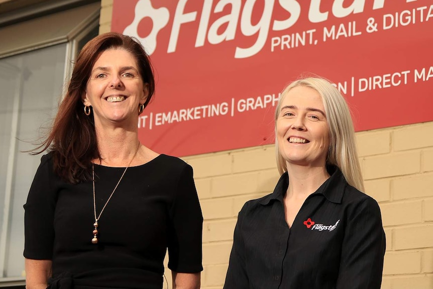 Brooke Anthony and Rachael Walton from Flagstaff stand out the front of their office.