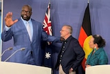 Shaquille O'Neal puts his hand on Anthony Albanese's shoulder as he and Linda Burney look up at him