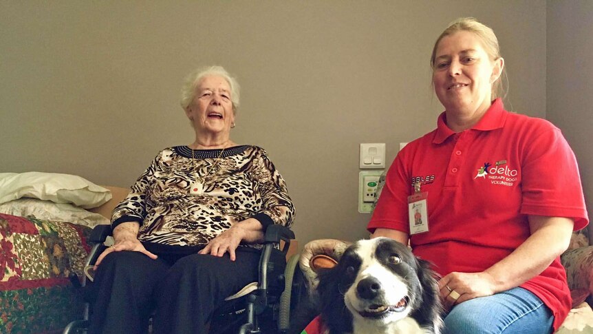 Nursing home resident with Delta Dog Tash and owner, Sue Jennings