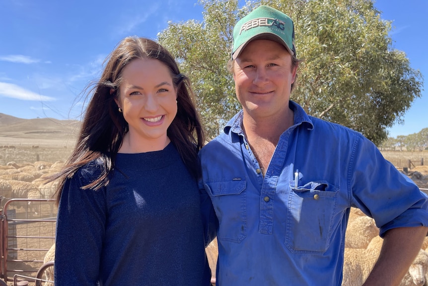 Photo of a man and a woman smiling on a rural property.