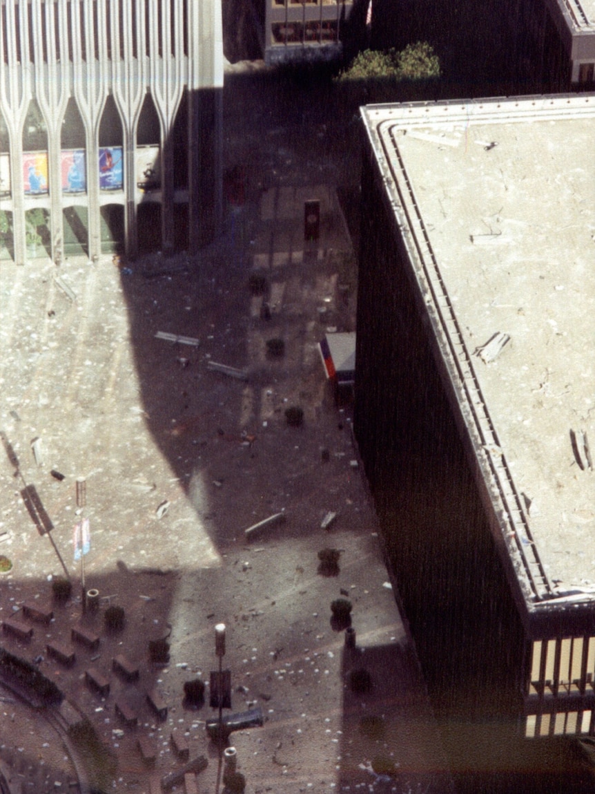 Debris lies scattered across a courtyard adjoining the World Trade Centre during the terrorist attacks of September 11, 2001.