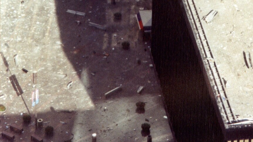 Debris lies scattered across a courtyard adjoining the World Trade Centre during the terrorist attacks of September 11, 2001.