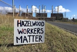 A hand-painted sign which reads 'Hazelwood workers matter' sits in the long grass on the road to the power station.