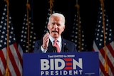 Democratic US presidential candidate and former Vice President Joe Biden speaks from a podium.