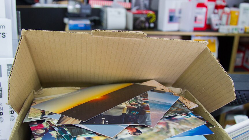 Boxes of photos printed from negatives.