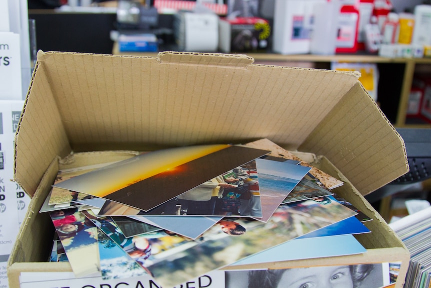 Boxes of photos printed from negatives.