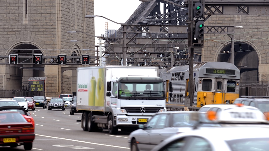 an image of the harbour bridge from 2009 showing the traffic lanes with cars, trains and trucks crossing