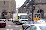 an image of the harbour bridge from 2009 showing the traffic lanes with cars, trains and trucks crossing