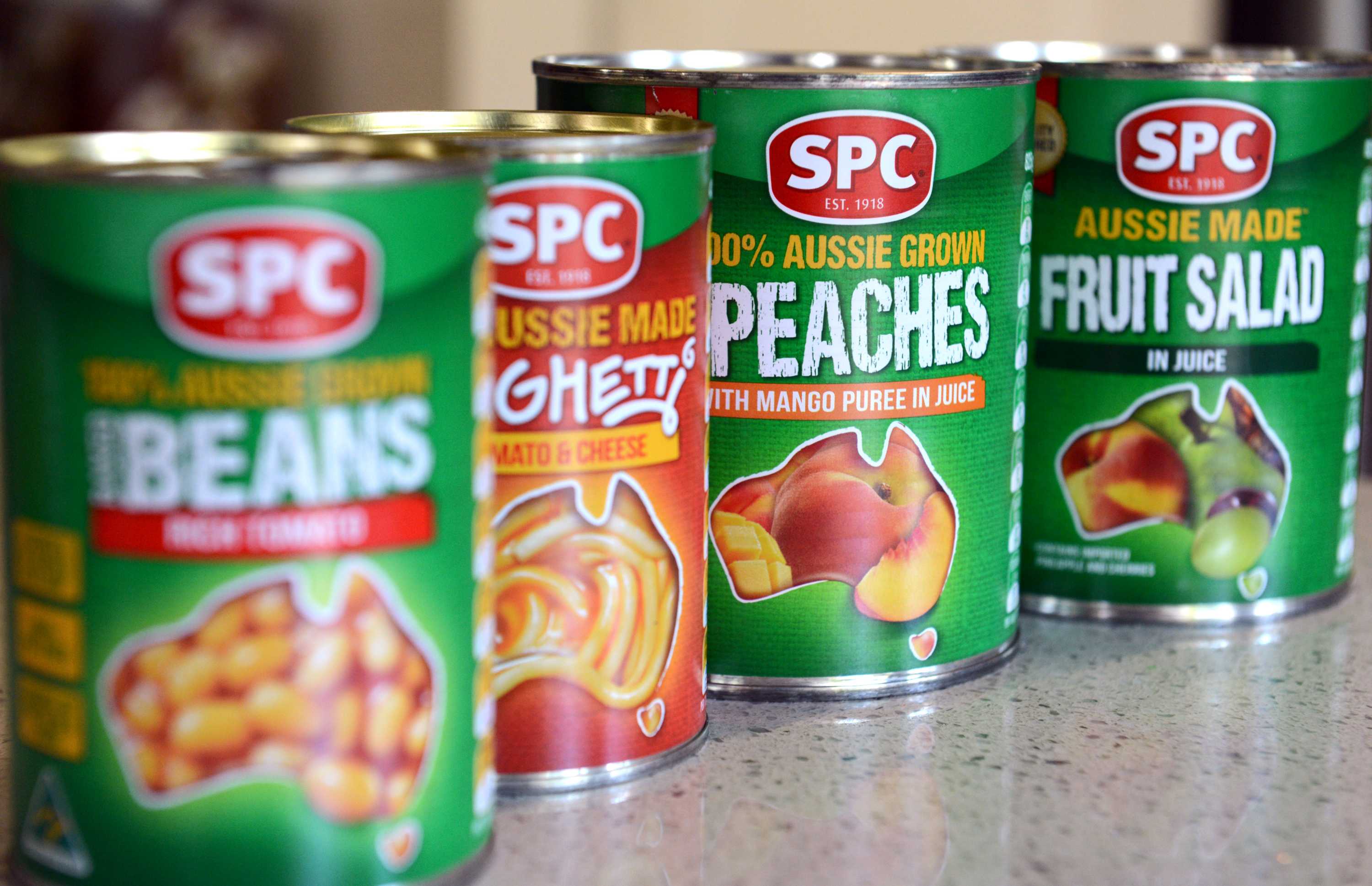 Cans of beans, spaghetti, peaches and fruit salad made by SPC Ardmona.