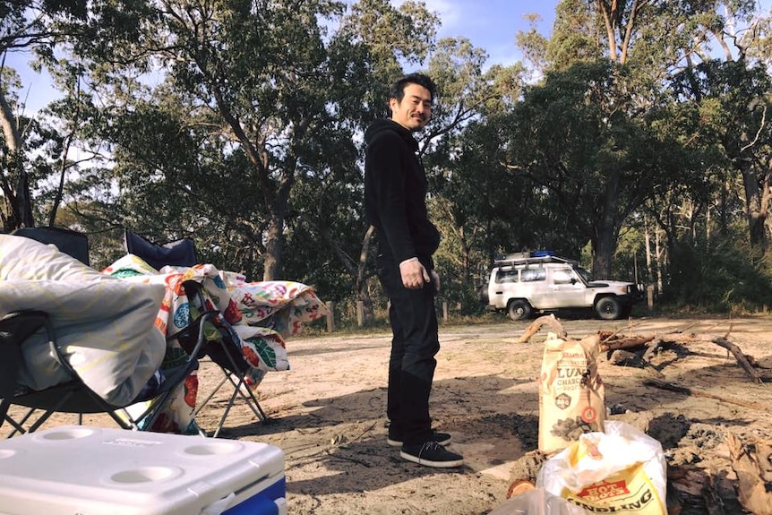 A backpacker on his camp on a farm