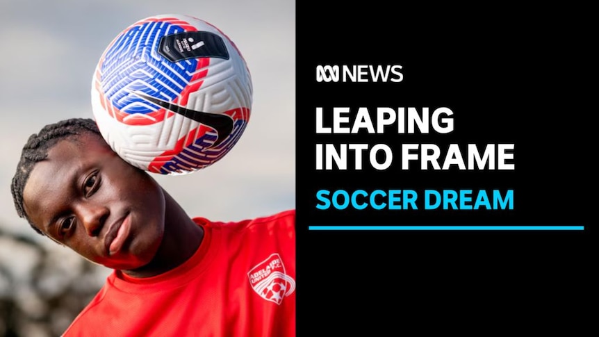 Leaping into Frame, Soccer Dream: A boy in a soccer kit with a ball next to his head.