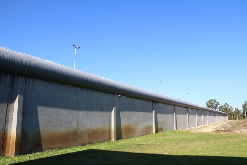 A concrete wall surrounding the Banksia Hill Detention Centre.