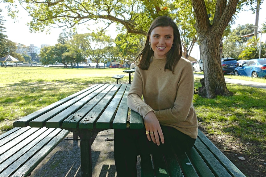 Annabel Munro sitting at a park bench in Double Bay.