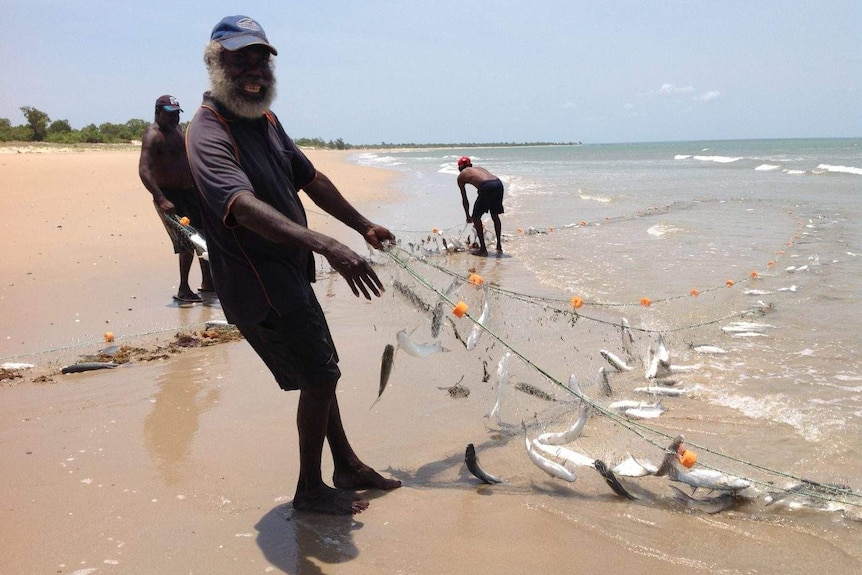 Don Wilton pulling fish in Maningrida