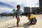 Children play in the sand
