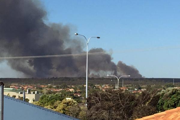Perth fire threatens lives and homes