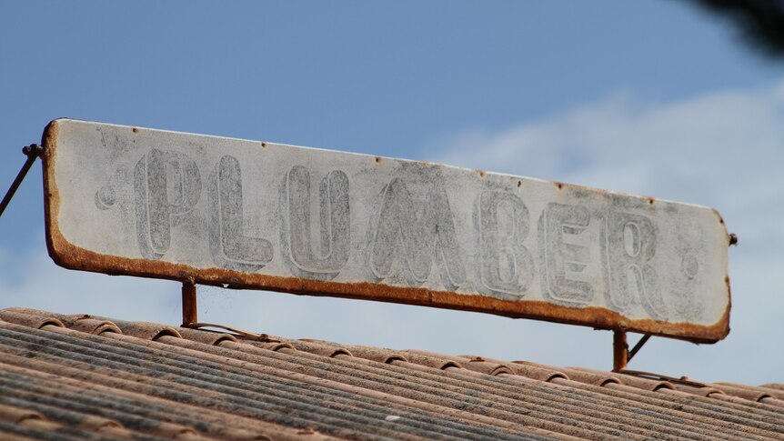 An old sign with faded writing
