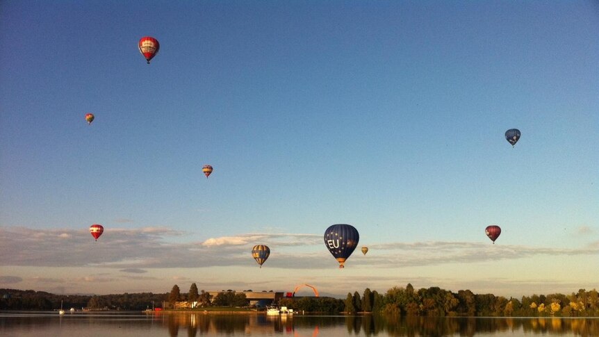 The colourful hot air balloons took to the sky over Lake Burley Griffin on Sunday for the Canberra Balloon Spectacular.