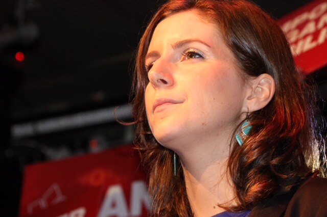 Labor's Clare Burns looks solemn as she takes to the stage at labor's event