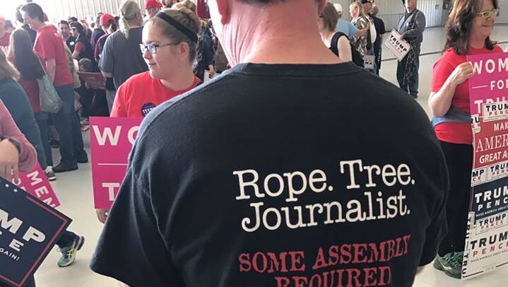 Man's shirt reads: Rope.Tree.Journalist. Some assembly required.