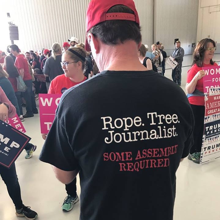 Man's shirt reads: Rope.Tree.Journalist. Some assembly required.
