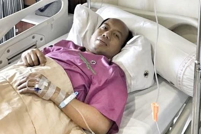 Mr Nugroho receiving treatment in hospital