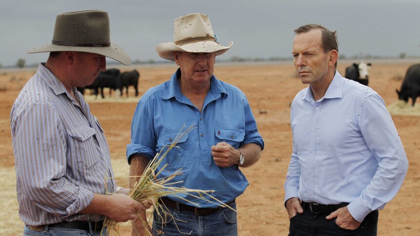 Tony Abbott and Barnaby Joyce meet a farmer in Bourke in 2014.
