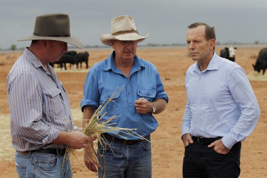 Tony Abbott and Barnaby Joyce meet a farmer in Bourke in 2014.