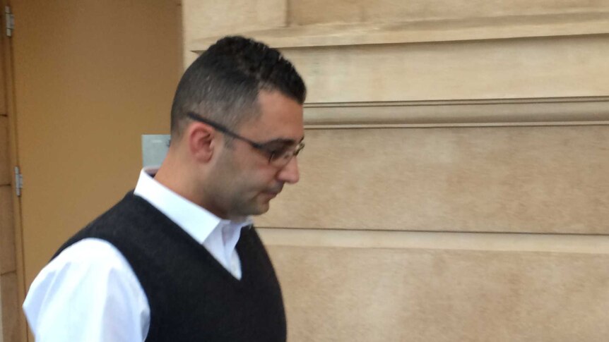 John Awad leaves the District Court in Adelaide.