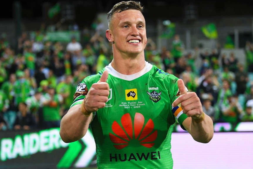 A Canberra Raiders NRL players smiles as he gives the double thumbs up after beating the Sydney Roosters.
