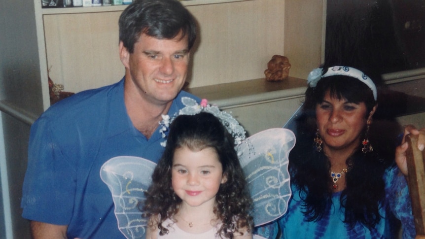 Raquel O'Brien as a little girl with her father and mother.