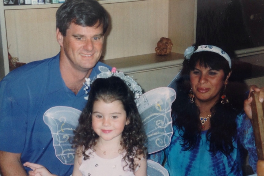 Raquel O'Brien as a little girl with her father and mother.