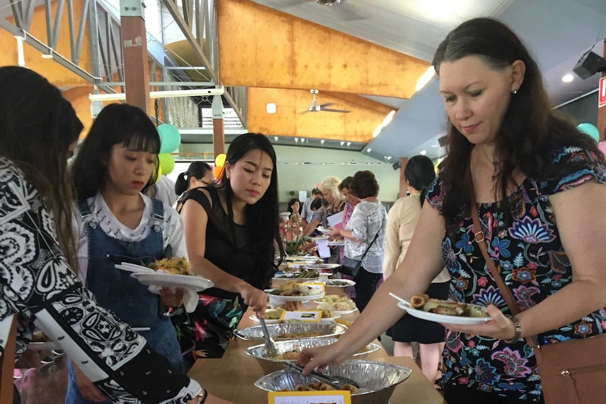 A group of people enjoy lunch at lunar new year