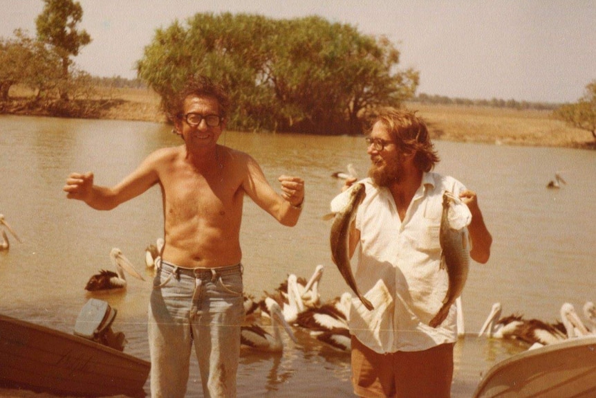 Two blokes standing at the banks of the Mary River.