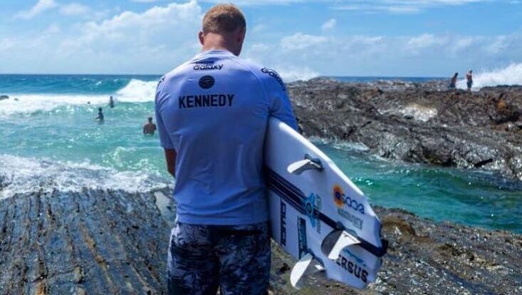 Surfer Stuart Kennedy waits on Snapper Rocks, Gold Coast