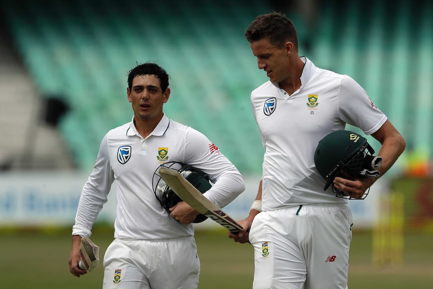 Quinton de Kock and Morne Morkel leave the field