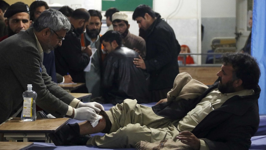 A man injured by a bomb blast in Pakistan is treated in hospital