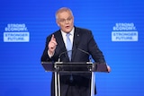 Scott Morrison points his finger while talking at a lectern.