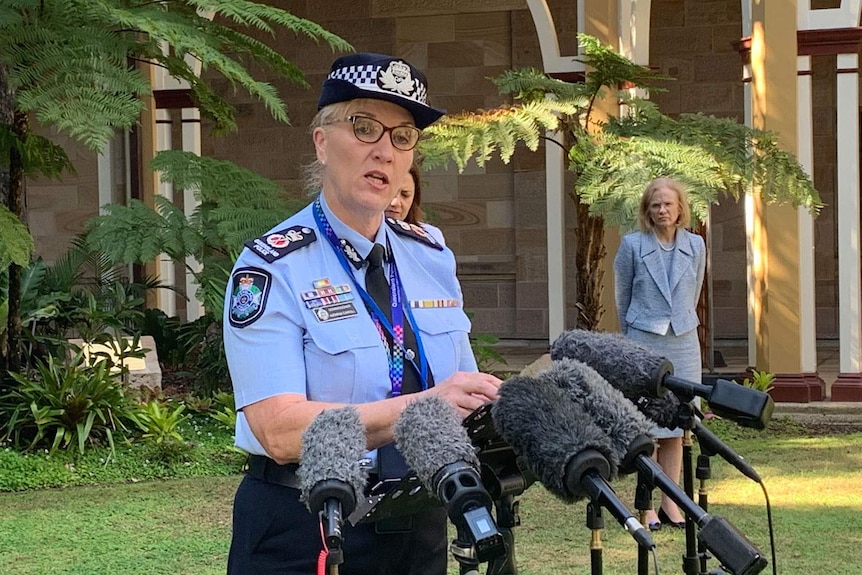 Queensland Police Commissioner Katarina Carroll speaks at a press conference with Dr Jeannette Young standing nearby.