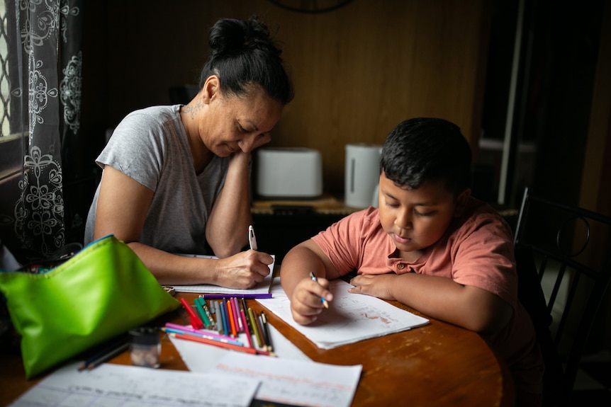 Jen draws with her son Marvin. 