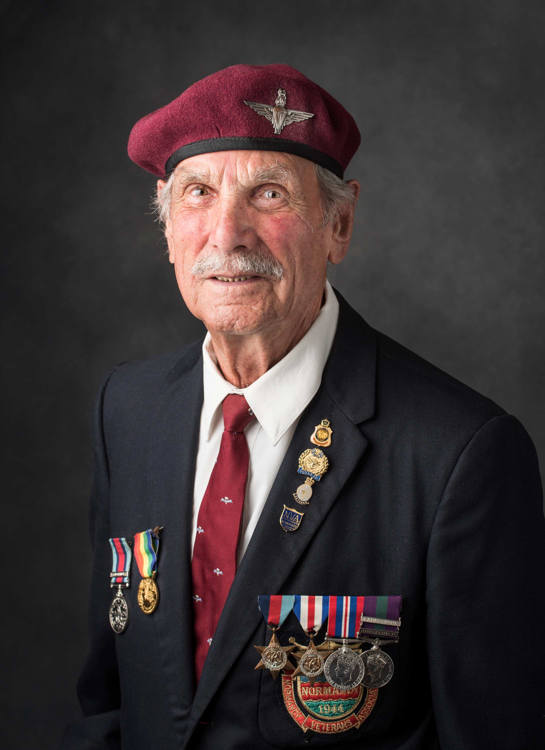 Portrait of an elderly man with war medals and cap
