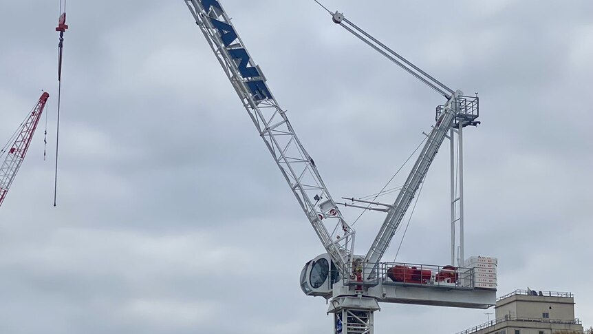 A large crane, against a cloudy sky.