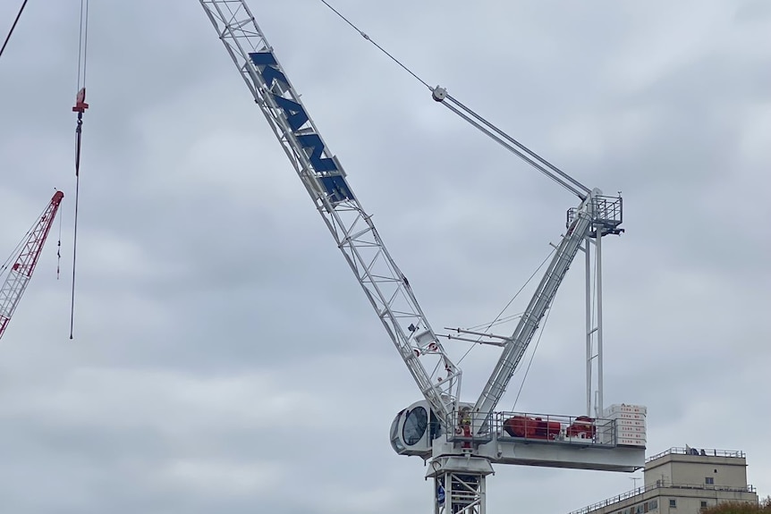 A large crane, against a cloudy sky.