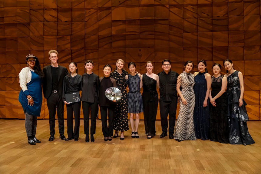 Stéphanie Kabanyana Kanyandekwe onstage at the Melbourne Recital Centre with all the MICMC string quartet grand finalists.