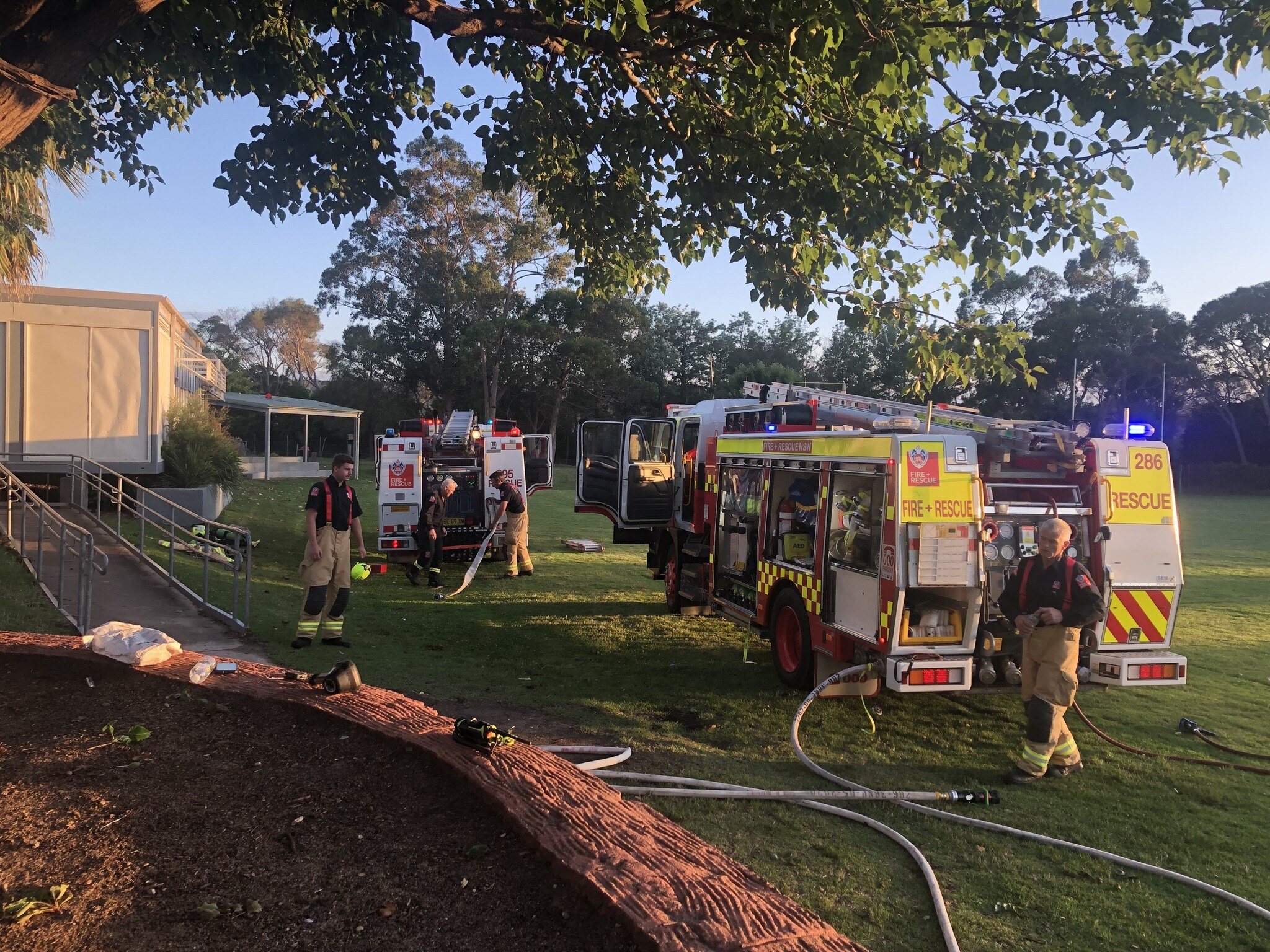 a fire truck parked on a school oval