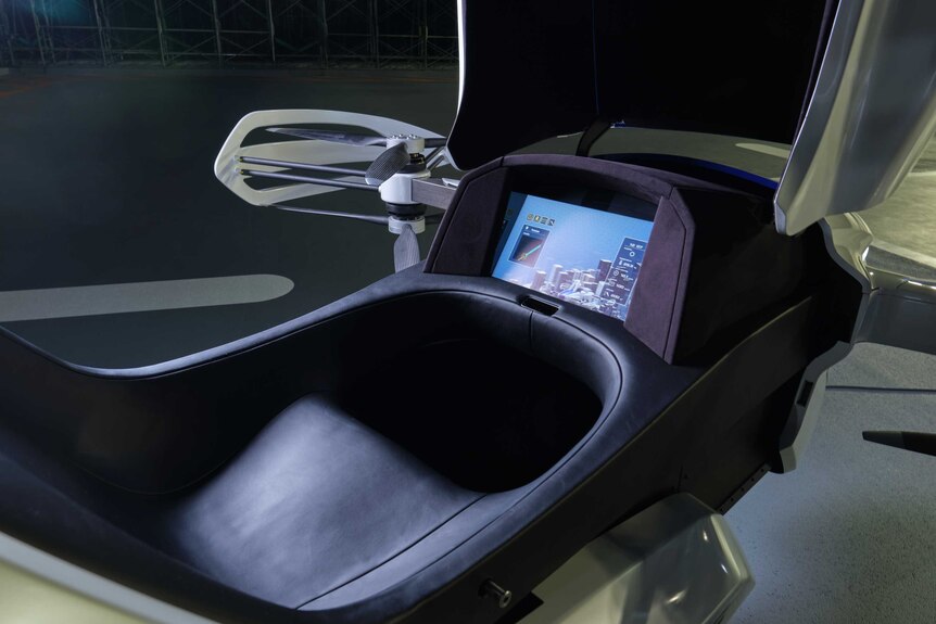 The controls and seat inside a flying car