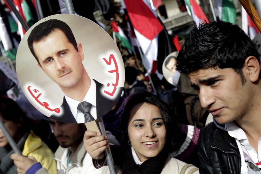 Syrian supporters of President Bashar Assad rally in Damascus.